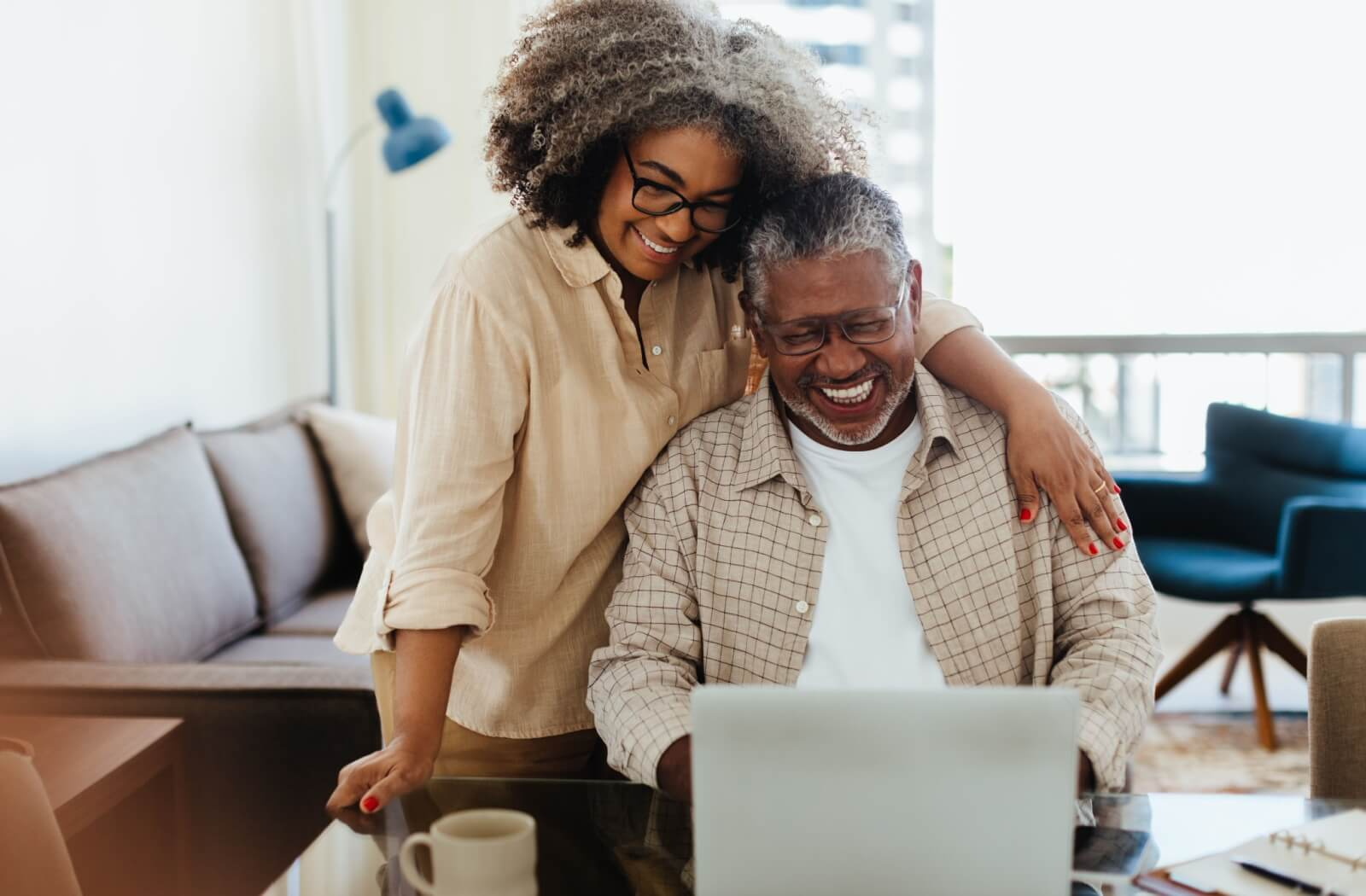 A senior couple excited at the prospect of different senior living options available for them in their community